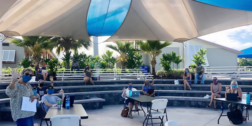 Teachers meet on the outdoor campus at WHEA